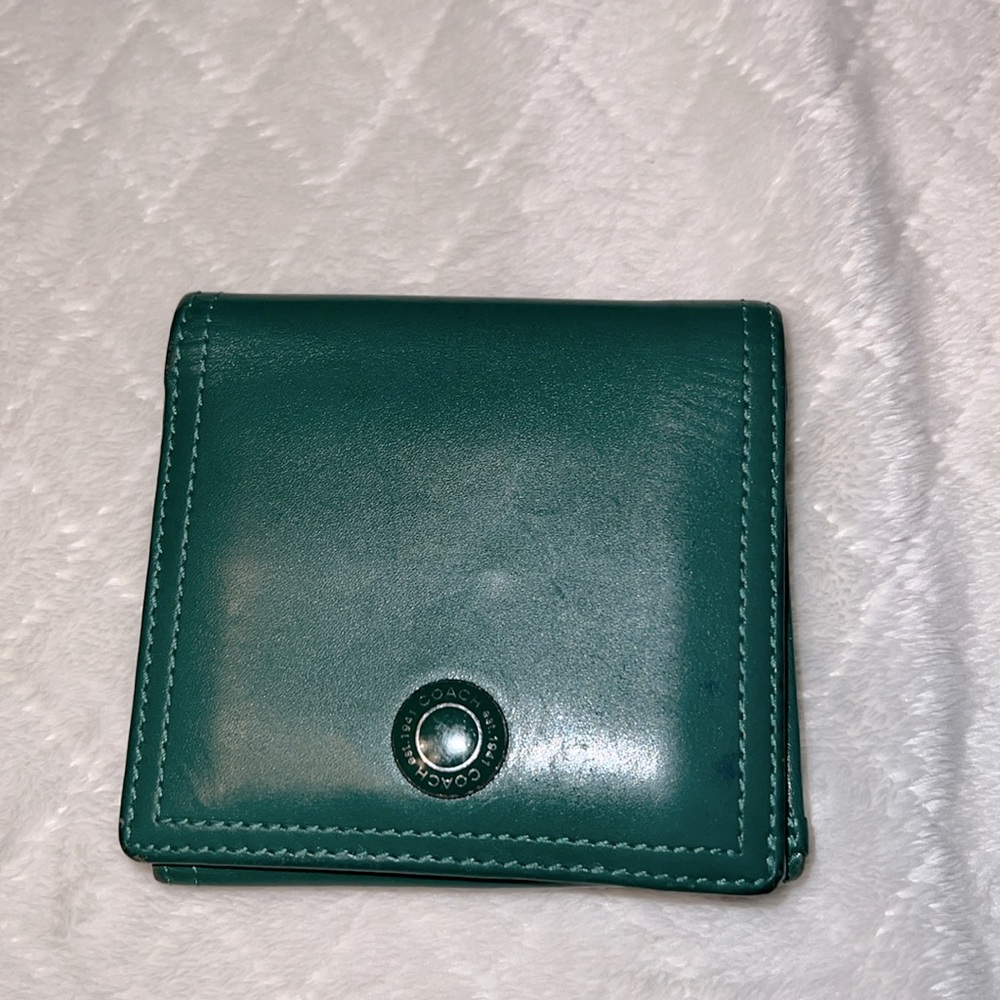 Coach Wallet 8  card slots
4 extra slide pockets
2 bill folds
1 coin snap pocket